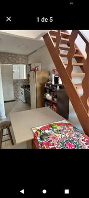 a picture of a kitchen with a table and stairs at Gerycasa in Cordoba