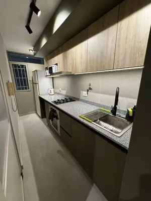 a kitchen with a sink and a counter top at Cañada Premium- Imgo- Mostaza Sanchez in Cordoba