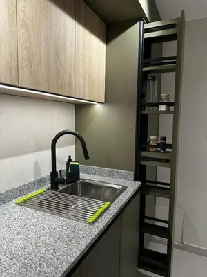 a kitchen sink with a green sponge next to it at Cañada Premium- Imgo- Mostaza Sanchez in Cordoba