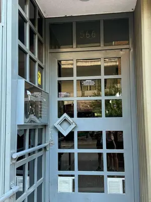 a door to a store with a sign on it at Cañada Premium- Imgo- Mostaza Sanchez in Cordoba