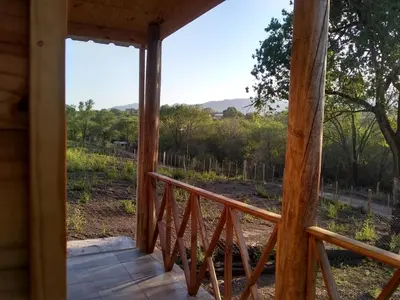 a view from the porch of a cabin with a view at CABAÑAS La Perla in Bialet Massé
