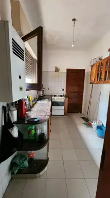 a kitchen with a counter and a counter top at Departamento house in Río Cuarto