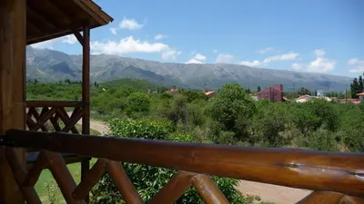 a view of the mountains from the porch of a cabin at Rincón de los Troncos in Merlo