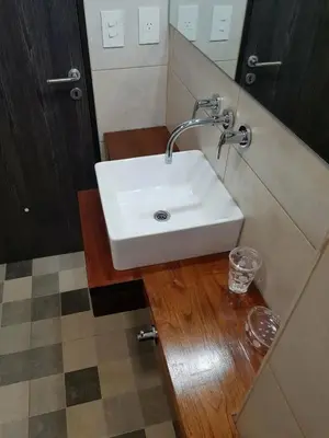 a bathroom with a white sink and a mirror at Alojamiento Premium en Las Marias De Cura Brochero in Villa Cura Brochero