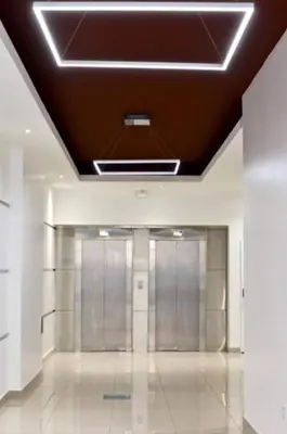 a hallway with silver elevators in a building at Unique & Cozy Apt in Cordobas heart in Cordoba