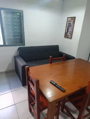 a living room with a table and a couch at Departamento azules in Cordoba