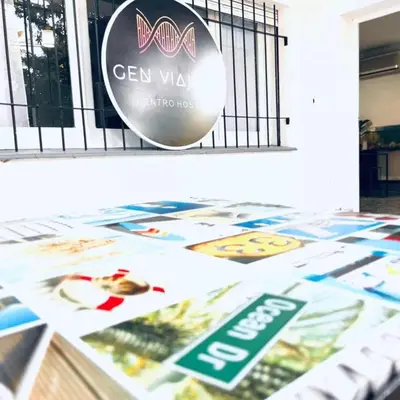 a bunch of brochures on top of a table at Gen Viajero Hostel in Merlo