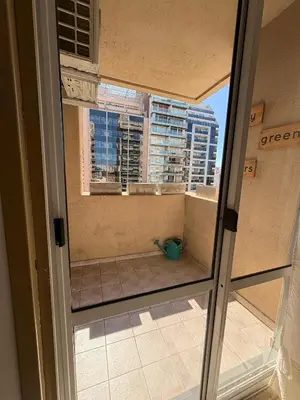 a view of a balcony from a room with a window at Chacabuco Nueva Cordoba in Cordoba