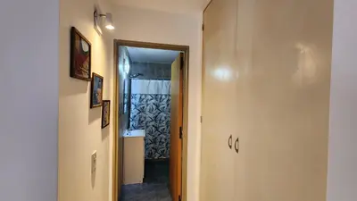 a hallway with a door leading to a bathroom at Chacabuco Nueva Cordoba in Cordoba