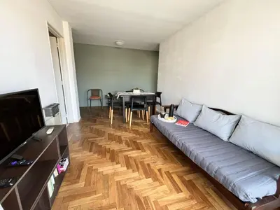 a living room with a couch and a table at Depto Ángeles Fragueiro in Cordoba