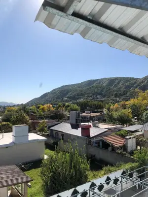 a view of a town with mountains in the background at alojamiento bella vista in Villa Carlos Paz
