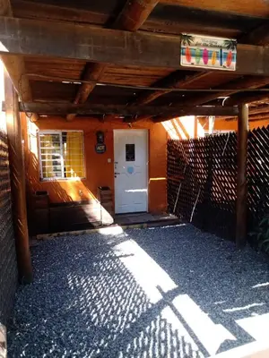 a front entrance to a house with a white door at Naiarai Cordoba in Santa María