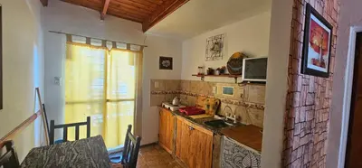 a kitchen with a sink and a counter at Naiarai Cordoba in Santa María