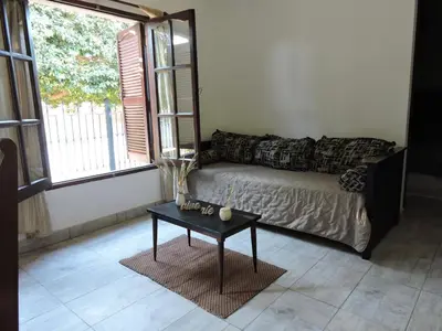 a living room with a couch and a table at La Casita de Lucía in Almafuerte