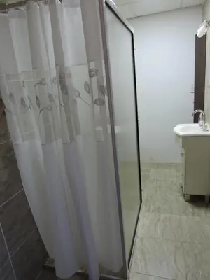 a shower curtain in a bathroom with a sink at La Casita de Lucía in Almafuerte