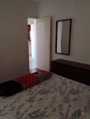 a bedroom with a dog bed laying on the floor at departamento de excelente ubicación, cochera , aire acondicionado in Villa Carlos Paz