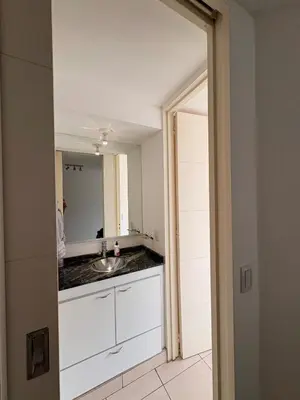 a kitchen with a sink and a mirror at Comfort and Convenience Apartment Near Park in Cordoba