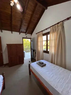 a bedroom with a large bed and a window at Casa Fiorenza in Merlo