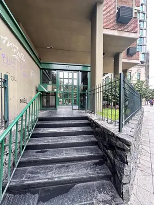 a staircase leading up to a building with graffiti at Departamento premium, Patio Olmos shopping !! in Cordoba