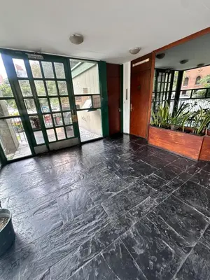 an empty room with large windows and a lobby at Departamento premium, Patio Olmos shopping !! in Cordoba