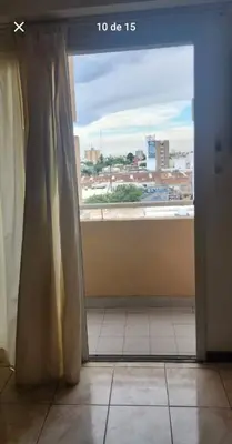a room with a window with a view of a city at La Terraza in Cordoba