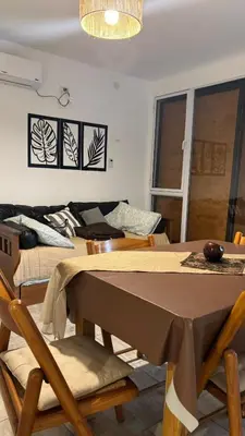a dining room with a table and some chairs at Brisas Rumipal dúplex premium Villa Rumipal in Villa Rumipal