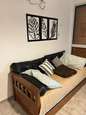 a bed with pillows on it in a room at Brisas Rumipal dúplex premium Villa Rumipal in Villa Rumipal