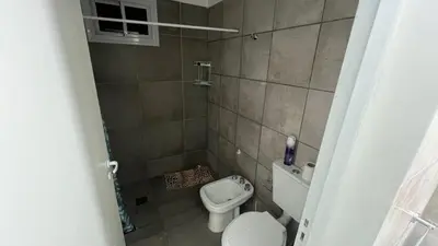 a small bathroom with a toilet and a bidet at Brisas Rumipal dúplex premium Villa Rumipal in Villa Rumipal