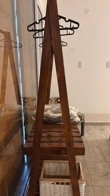 a wooden ladder in a room with a bed at Brisas Rumipal Dúplex Premium in Villa Rumipal