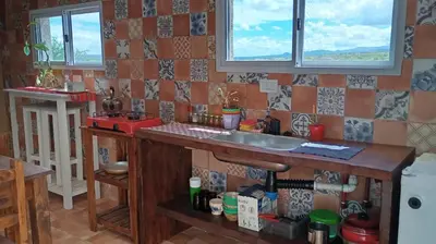 a kitchen with a sink and a counter top at Hostal El Portillo in Arroyo de Los Patos