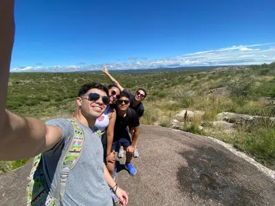 a group of people standing on a dirt road at Hostal El Portillo in Arroyo de Los Patos