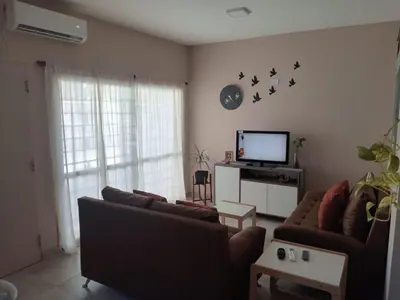 a living room with two couches and a flat screen tv at Urbana Home Córdoba in Cordoba