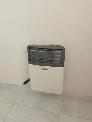 a radiator sitting on a floor next to a wall at Urbana Home Córdoba in Cordoba