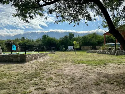 a park with a tennis court in a field at Cabañas Enki in La Paz