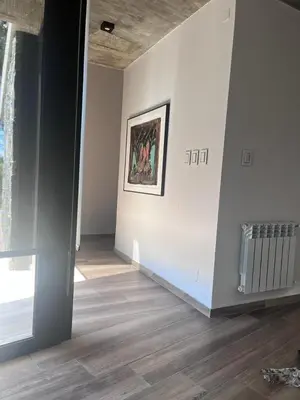an empty room with a painting on the wall at Casa en Molvento in Villa Los Molinos