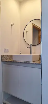 a bathroom with a sink and a mirror at Moderno departamento a estrenar in Alta Gracia