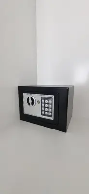 a microwave oven attached to a white wall at Moderno departamento a estrenar in Alta Gracia