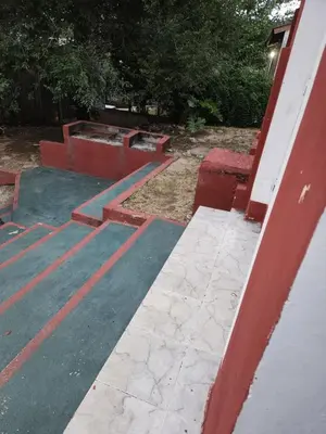 a set of concrete steps in a yard at Altos de Grecia Cabaña 1 in Villa Carlos Paz