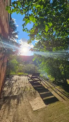 a bench sitting on the side of a dirt road at Altos de Grecia Cabaña 2 in Villa Carlos Paz
