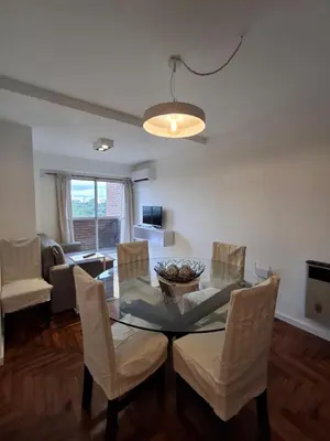 a dining room with a table and chairs at Excepcional departamento en Nueva Córdoba in Cordoba