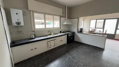 a kitchen with a sink and a stove in it at La casa de Rena in Santa Rosa de Calamuchita