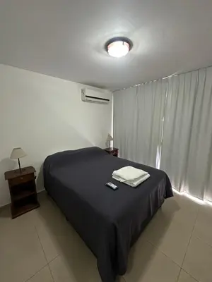 a bedroom with a bed with two towels on it at Departamento Gral Paz - Felix Frias 334 in Cordoba