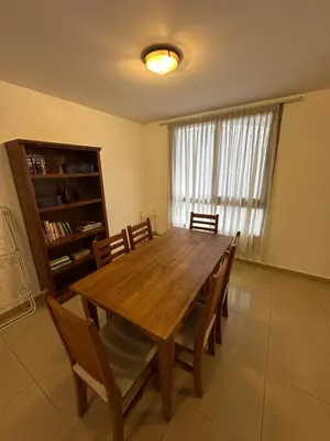 a dining room with a wooden table and chairs at Departamento Gral Paz - Felix Frias 334 in Cordoba