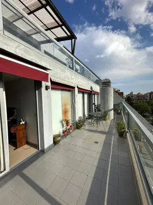 an outdoor balcony of a house with a roof at Departamento Gral Paz - Felix Frias 334 in Cordoba