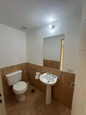 a bathroom with a toilet and a sink at Departamento Gral Paz - Felix Frias 334 in Cordoba