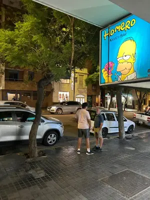 a group of people standing in a parking lot at Pueyrredón 76 in Cordoba