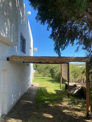 a wooden pergola on the side of a building at Don Nico in Cavalango