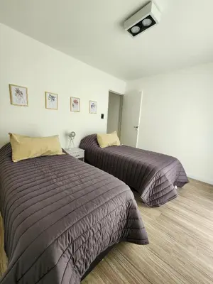 two beds in a room with two beds sidx sidx sidx at Dpto Ituzaingo 1270 - 2 dormitorios in Cordoba