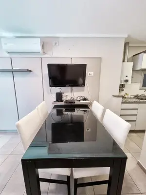 a desk with a computer on top of it in a kitchen at Dpto ituzaingo 741 - 1 dormitorio in Cordoba