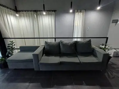 a couch in a living room with two pillows at El Paisaje in Villa Parque Siquiman